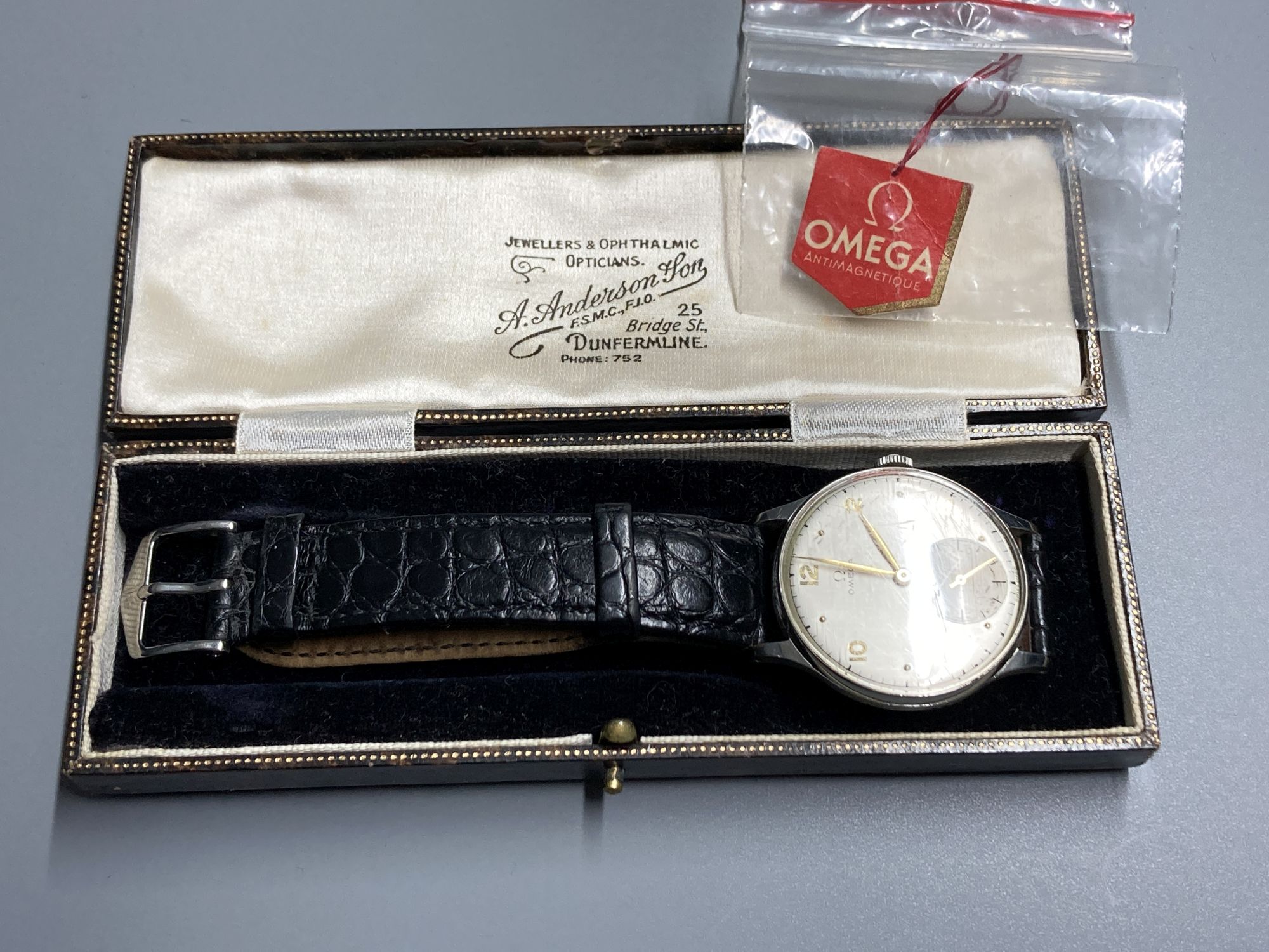 A gentlemans 1940s? stainless steel Omega manual wind wrist watch, with Arabic and dot numerals